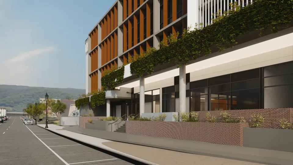 Render of the main entrance along Showground Road: cascading podium planting above a colonnade, glazed lobby and brick planters