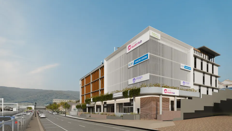 Daylight render of Gosford Health Hub from Showground Road, with Gosford Health Hub and tenant signage on the white fin façade and the hills at the end of the street