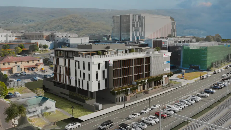 Elevated render of Gosford Health Hub from its west corner, with the Gosford Hospital towers behind and parked cars along Showground Road in front