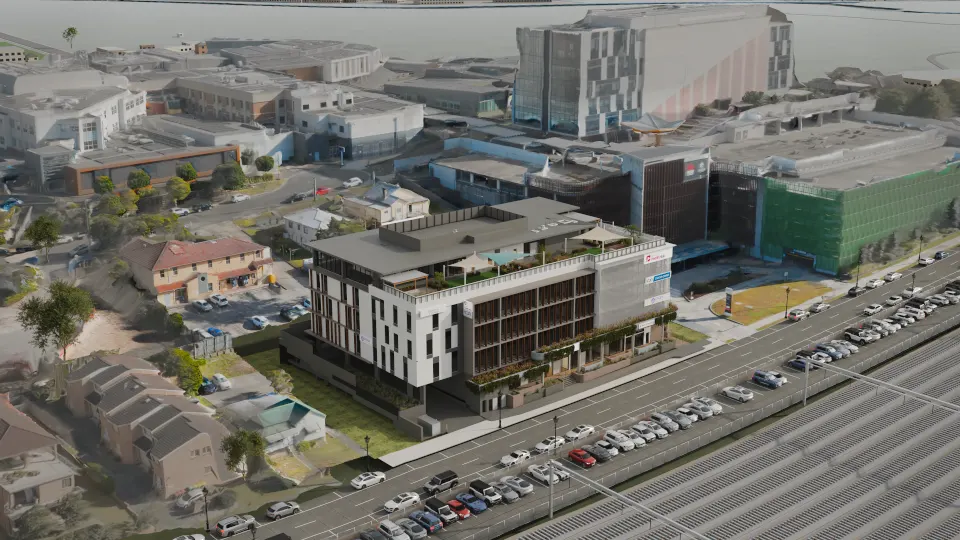 Aerial render of Gosford Health Hub with the Gosford Hospital campus directly behind it and Showground Road and the rail line in front